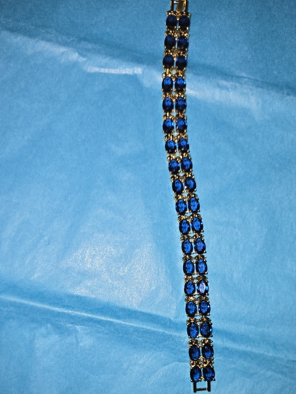 Gold-Tone Bracelet with Deep Blue Crystal Accents